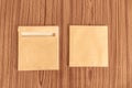 Set of two Brown envelope front and back isolated on wooden table hardwood floor background. Business cards blank. Mockup. Top Royalty Free Stock Photo