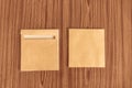 Set of two Brown envelope front and back isolated on wooden table hardwood floor background. Business cards blank. Mockup. Top Royalty Free Stock Photo