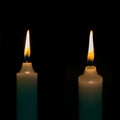 Two burning candles on dark background Royalty Free Stock Photo