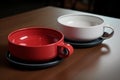 Set of two ceramic bowls on table. Red and white or cups. Generative AI Royalty Free Stock Photo