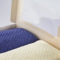 A set of two cotton terry towels in a paper box on a light background Royalty Free Stock Photo