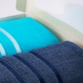 A set of two cotton terry towels in a paper box on a light background Royalty Free Stock Photo