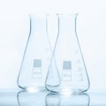 Set of two empty temperature resistant conical flasks for measurments Royalty Free Stock Photo