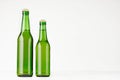 Set of two green longneck beer bottles 330ml, mock up. Royalty Free Stock Photo