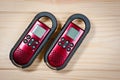 Set of two intercoms of red color on a wooden background