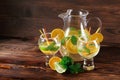 Exotic lemonade with mint and oranges. Big party glasses on a table background. Fresh cocktails at the bar. Copy space. Royalty Free Stock Photo