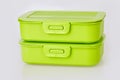 Set of two similar green plastic food storage containers Royalty Free Stock Photo