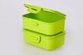 Set of two similar green plastic food storage containers Royalty Free Stock Photo