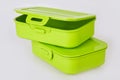 Set of two similar green plastic food storage containers Royalty Free Stock Photo