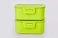 Set of two similar green plastic food storage containers Royalty Free Stock Photo