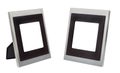 Set of two vertical standing empty square aluminium photo frames with wide brown border isolated on white background