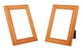 Set of two vertical standing empty varnished ginger wooden frames for photo or painting isolated on white background