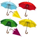 Set of umbrellas. Umbrellas of different colors opened and collected on a white isolated background