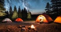Set up a cozy camping scene with a tent pitched under the starry night sky, illuminated by a warm campfire Royalty Free Stock Photo