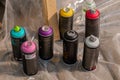 Set of used spray paint cans at summer graffiti festival Royalty Free Stock Photo