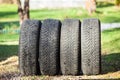 Set of used winter tires removed from car after cold season, spring