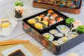 Set of variety sushi, Tamagoyaki, crabsticks sushi and maki in bento box served with soy sauce and wasabi. Delicious japanese food Royalty Free Stock Photo