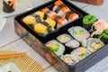 Set of variety sushi, Tamagoyaki, crabsticks sushi and maki in bento box served with soy sauce and wasabi. Delicious japanese food Royalty Free Stock Photo