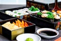 Set of variety sushi, Tamagoyaki, crabsticks sushi and maki in bento box served with soy sauce and wasabi. Delicious japanese food Royalty Free Stock Photo