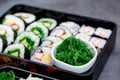 Set of variety sushi, Tamagoyaki, crabsticks sushi and maki in bento box served with soy sauce and wasabi. Delicious japanese food Royalty Free Stock Photo