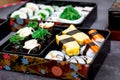 Set of variety sushi, Tamagoyaki, crabsticks sushi and maki in bento box served with soy sauce and wasabi. Delicious japanese food Royalty Free Stock Photo