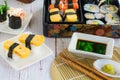 variety sushi on white plate and bento box served with soy sauce and wasabi. Delicious japanese food Royalty Free Stock Photo