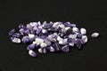 Set of various amethyst natural mineral stones and gemstones on black background Royalty Free Stock Photo