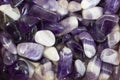 Set of various amethyst natural mineral stones and gemstones on craftpaper Narrow focus line, shallow depth of field