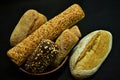 A set of various baguettes and rye bread lie in a bread basket Royalty Free Stock Photo