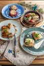 Set of various chicken and fish dishes main course on wooden table Royalty Free Stock Photo