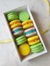 Set of various colored macarons and gift boxes with ribbon Royalty Free Stock Photo