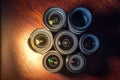Set of various DSLR lenses with colorful reflections on wooden table