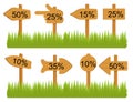Set of various empty wooden sign boards, wood arrow sign on green grass. Retro, old or vintage signs point on percent.