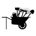 Set of various gardening tools in a wheelbarrow. Items for gardening and farming. Set of farm tools. Garden instruments collection Royalty Free Stock Photo