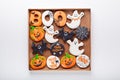 Set of various Halloween gingerbread cookies on white background. Bright homemade cookies for Halloween party