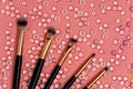 Set of various makeup brushes on pink background Royalty Free Stock Photo