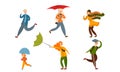 Set of various people on a rainy and windy day. Vector illustration in flat cartoon style. Royalty Free Stock Photo