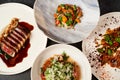 Set of various plates of food on a gray table background with copy space Royalty Free Stock Photo