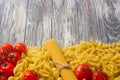 Set various raw ingredients for cooking Italian pasta on gray table, top view Royalty Free Stock Photo