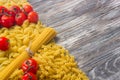 Set various raw ingredients for cooking Italian pasta on gray table, top view Royalty Free Stock Photo