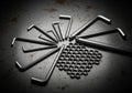 A set of various-sized L-shaped Allen wrenches are arranged in a semi-circle on a Royalty Free Stock Photo