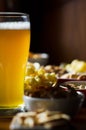 Set of various snacks, pint of lager beer in a glass, a standard set of drinking and eating in a pub Royalty Free Stock Photo