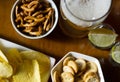 Set of various snacks, pint of lager beer in a glass, a standard set of drinking and eating in a pub Royalty Free Stock Photo