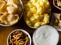 Set of various snacks, pint of lager beer in a glass, a standard set of drinking and eating in a pub Royalty Free Stock Photo