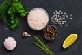 Set of various spices for cooking. fresh garlic, yellow lemon, greens, Pink Himalayan salt and mix of peppers Royalty Free Stock Photo