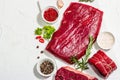 Set of various steaks with spices and herbs. Eye round, flank and striploin steaks Royalty Free Stock Photo