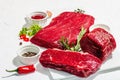 Set of various steaks with spices and herbs. Eye round, flank and striploin steaks Royalty Free Stock Photo