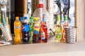 A set of various sugary drinks and beer, different cold beverage brands on an outdoors market stall, shop, group of objects