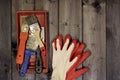 Set of various working painting tools - spatulas, brush, tray and work gloves on a dark wooden background with copy space Royalty Free Stock Photo