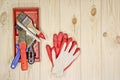 Set of various working painting tools - spatulas, brush, tray and work gloves on a light wooden background with copy space Royalty Free Stock Photo